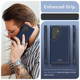 Image featuring a man on the left side talking on the phone while showcasing a navy blue phone case for Samsung Galaxy S24 Ultra. On the right, a close-up reveals the case's 'Enhanced Grip,' highlighting its textured surface. In the bottom right, the text emphasizes the secure and comfortable grip provided by the textured design on both sides and back of the case.
